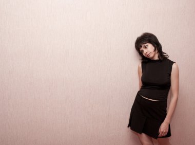 Brunette girl on a pink background