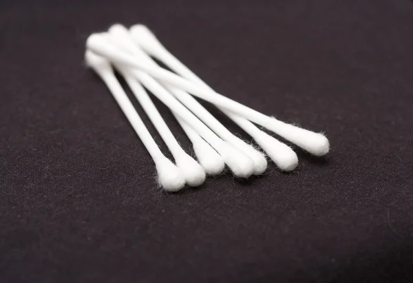 Cotton sticks isolated on black background — Stock Photo, Image