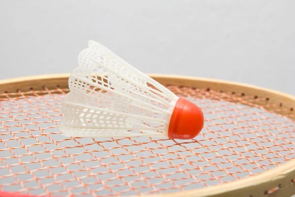 Badminton shuttlecocks with the racket — Stock Photo, Image