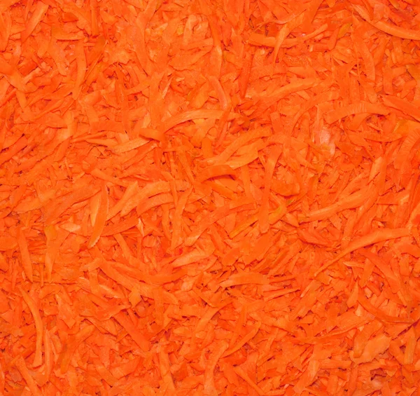 Fondo de zanahorias ralladas. Primer plano . — Foto de Stock