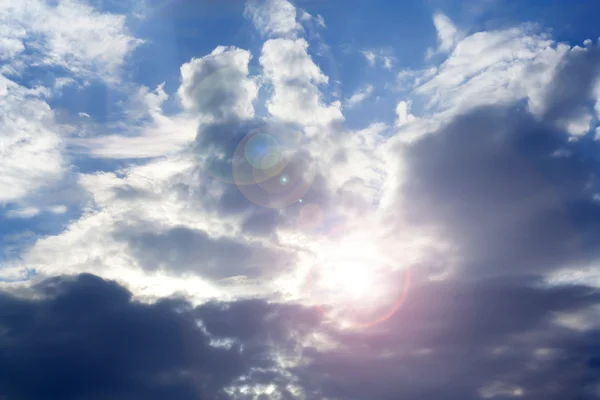 stock image Blue sky with clouds and sun.