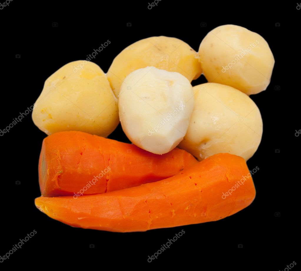 Boiled potatoes and carrots on a black background — Stock Photo