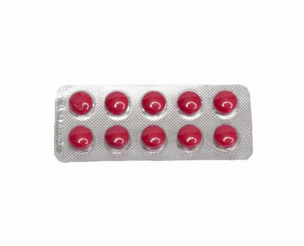 Geïsoleerde rode pillen op een witte achtergrond — Stockfoto