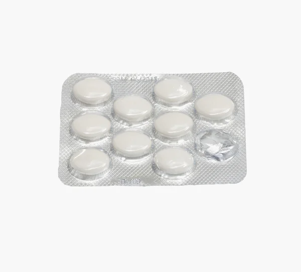 Comprimidos sobre um fundo branco — Fotografia de Stock