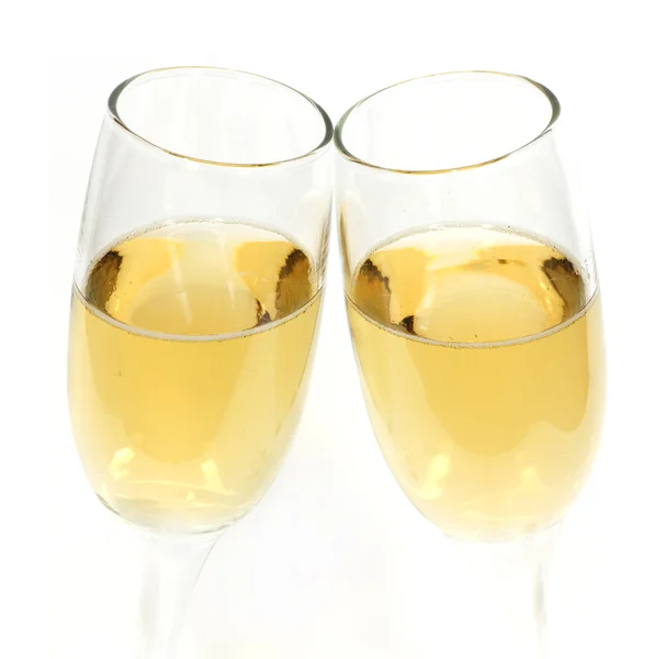 Par de taças de champanhe fazendo um brinde — Fotografia de Stock