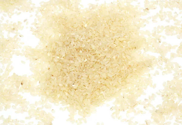 Beyaz zemin üzerinde kahverengi pirinç — Stok fotoğraf
