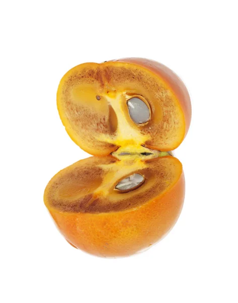 Two ripe halves of a persimmon — Stock Photo, Image