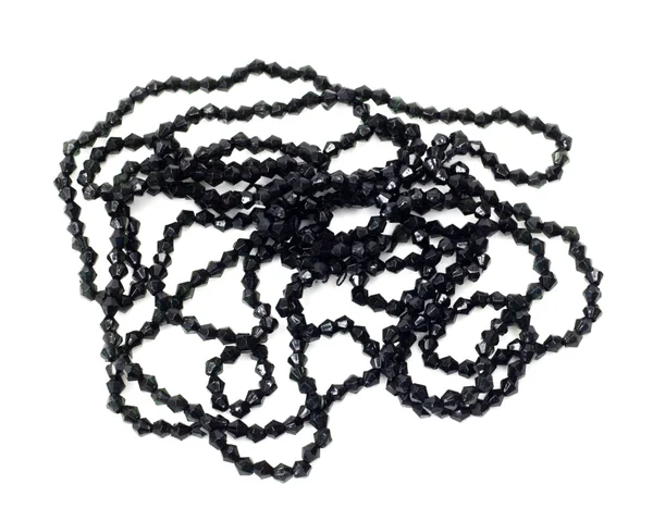 Черное ожерелье с маленькими бриллиантами на белой спине — стоковое фото