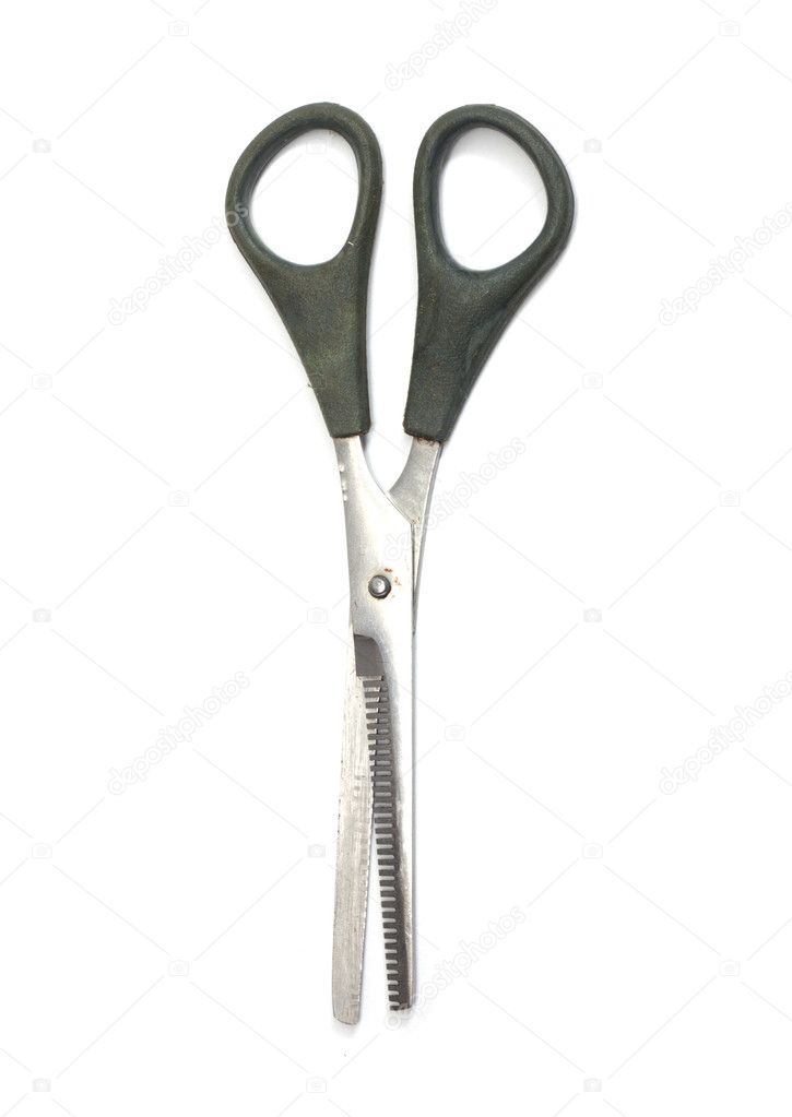 Jagged edges hairdressing scissors. Isolated over white