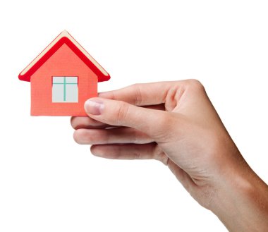 Woman's hand holding sign of the house. Isolated clipart