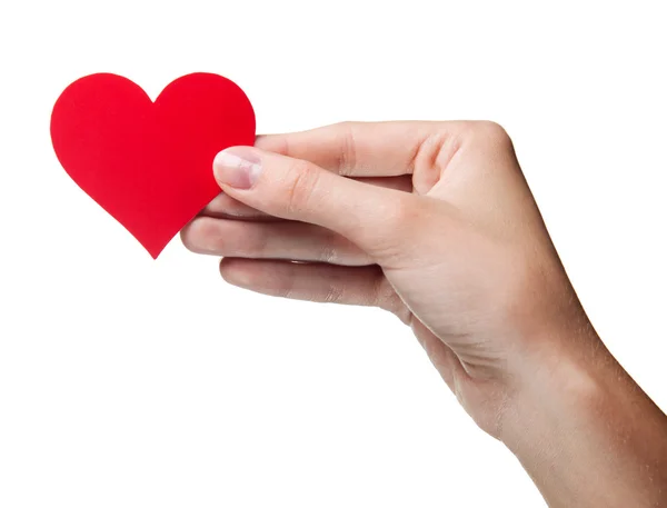 Ženská ruka držící symbolu - červené srdce. Izolovaný — Stock fotografie