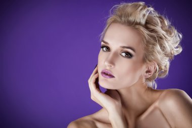 The image of a beautiful luxurious woman on purple background. S clipart