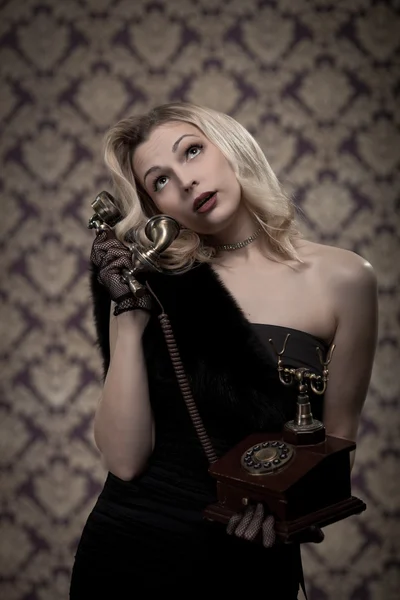 Blond woman talking on the phone. Retro portrait — Stock Photo, Image