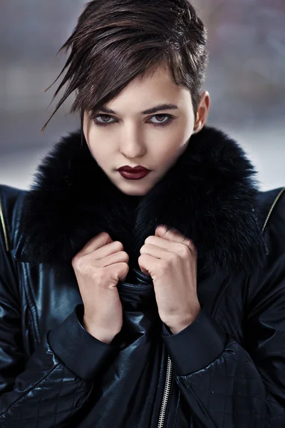 Stylish brunette woman in leather coat — Stock Photo, Image