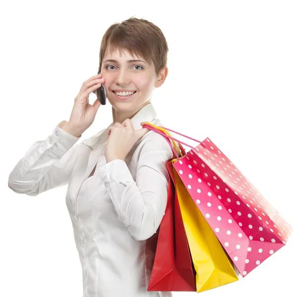Όμορφη εμπορική γυναίκα ευτυχισμένη κρατώντας τσάντες αγορών. — Φωτογραφία Αρχείου