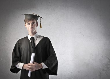 Young graduate student holding a diploma clipart