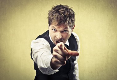 Angry man pointing his finger against somebody clipart