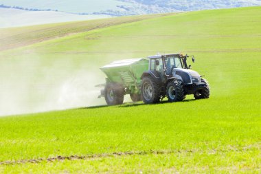 Tractor on field, Czech Republic clipart