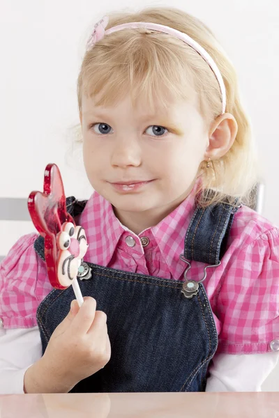 Portrét holčička s velikonoční lízátko — Stock fotografie