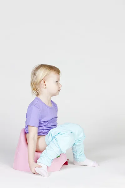 Little girl using potty — Stock Photo, Image