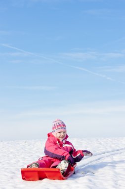 Little girl with bob in snow clipart