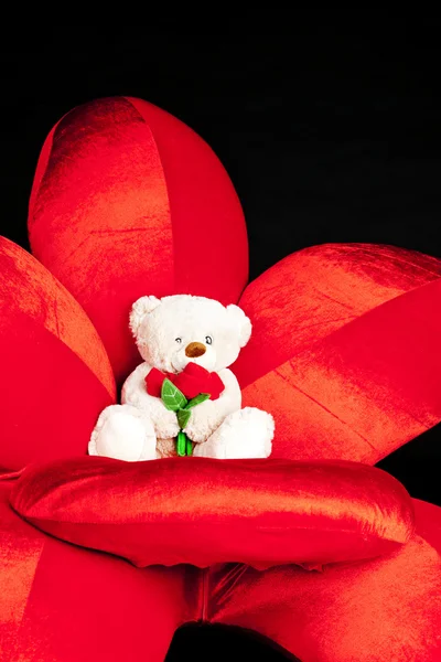 Teddy bear on red armchair — Stock Photo, Image