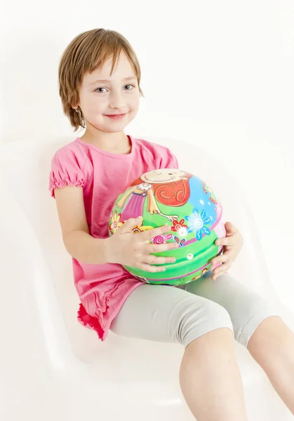 Portrait of girl sitting with a ball — Stock Photo, Image