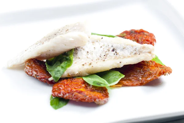 Cod with dried tomatoes and basil