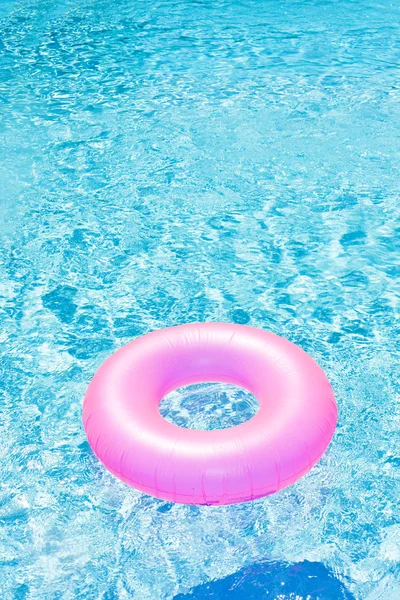 Stock image Pink rubber ring in swimming pool