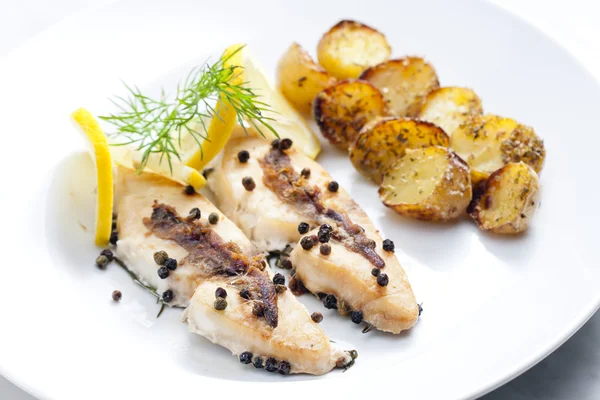Butterfish baked on pepper and anchovies — Stock Photo, Image