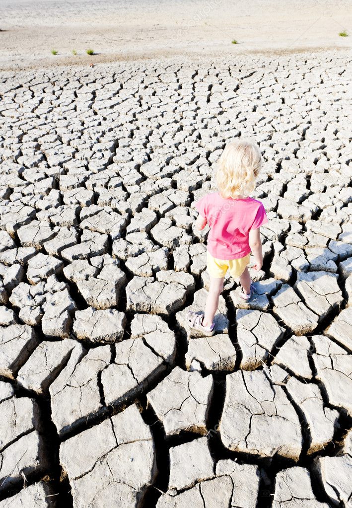 Little girl standing on dry land, Parc Regional de Camargue, Pro