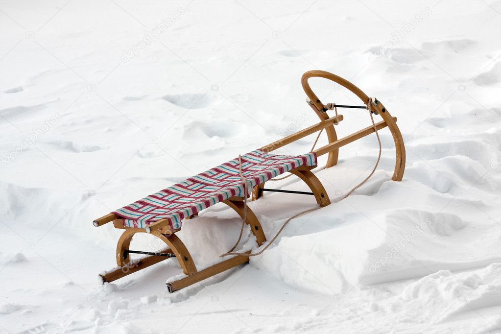 Wooden sledge on snow