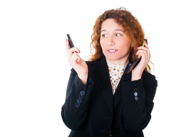 Ung affärskvinna med två mobiltelefoner — Stockfoto