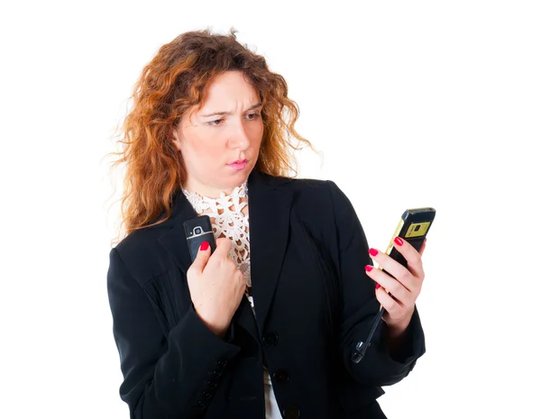 Jovem mulher de negócios com dois telefones celulares — Fotografia de Stock