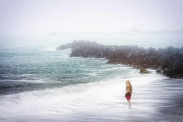 Depression and sadness concept - woman and foggy sea — Stock Photo, Image
