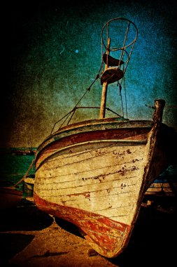 Wreck of rusty antique boat in grunge style clipart