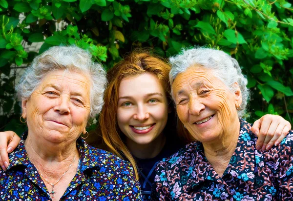 Mujer joven y dos señoras mayores —  Fotos de Stock