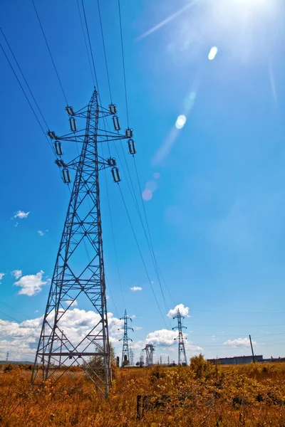 Power lines, blue sky and sun light — Stock Photo, Image