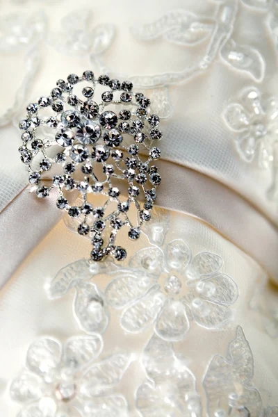 stock image Diamond jewelry on vintage wedding dress