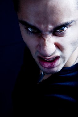 Frown of scary sinister evil vampire man clipart