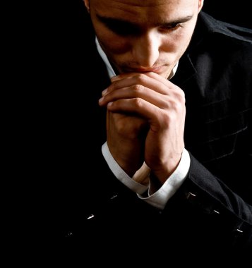 Businessman praying