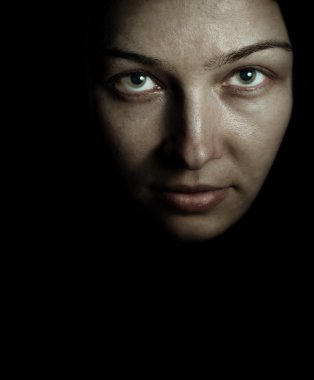 Face and eyes of spooky mystery woman in the dark clipart