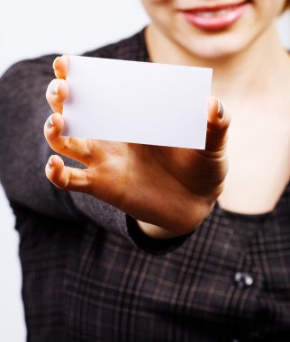 Woman holding blank business card clipart