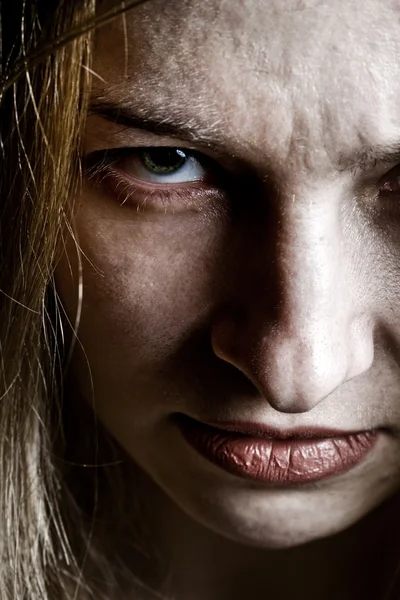 Close up on angry evil upset scary face — Stockfoto