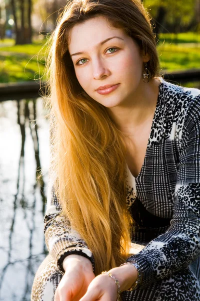 Outdoor portrait of beautiful serene young woman — Stock Photo, Image