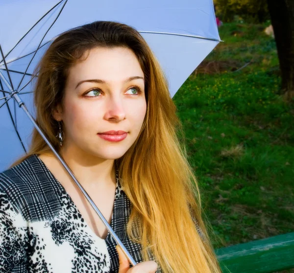 Beautiful sensual blond woman with umbrella — Stock Photo, Image