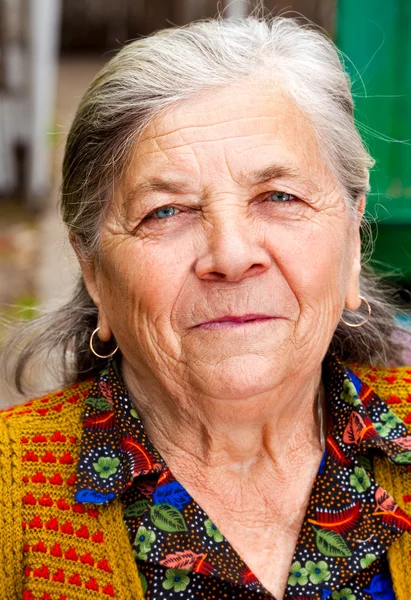 Closeup portrait of one content senior woman — Stock Photo, Image