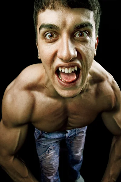 Homem muscular fazendo uma cara engraçada — Fotografia de Stock