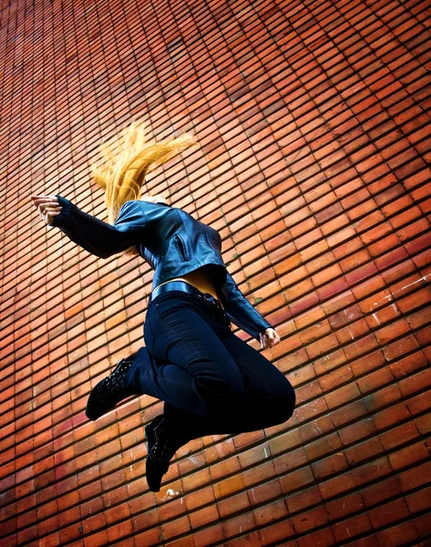 Young energic woman jumping Stock Picture
