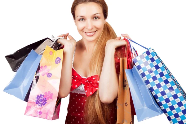 圣诞购物概念-礼品袋的女人 免版税图库照片